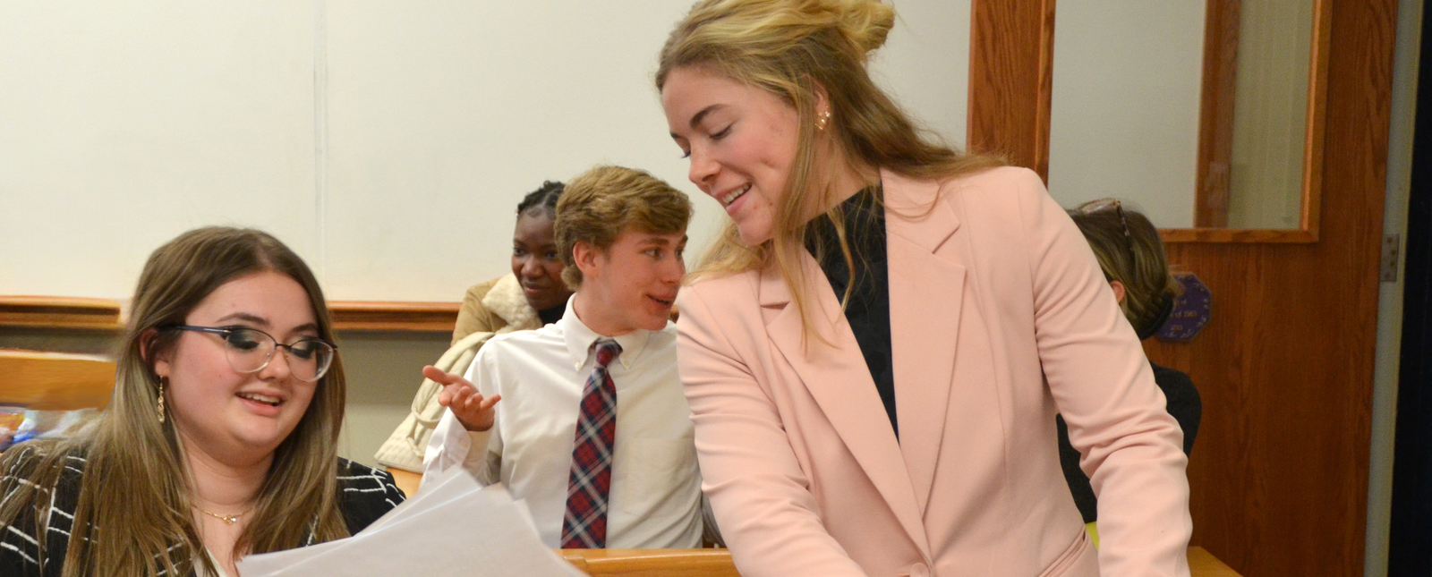 Students act out roles during a mock trial in class. 