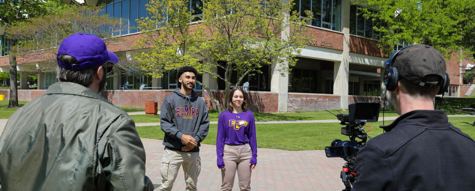 Two students are filmed during production of the Elmira College Virtual Campus Tour Video in 2023. 