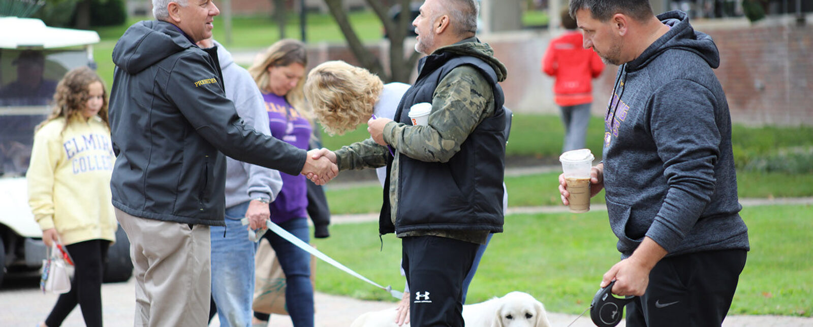 President Lindsay talks with parents on campus.