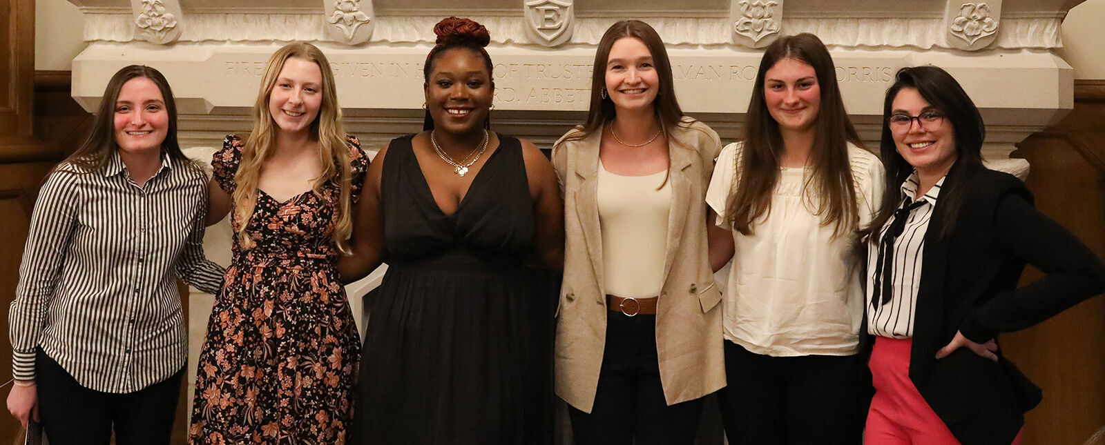 A group of female students stand together during the Honors Banquet