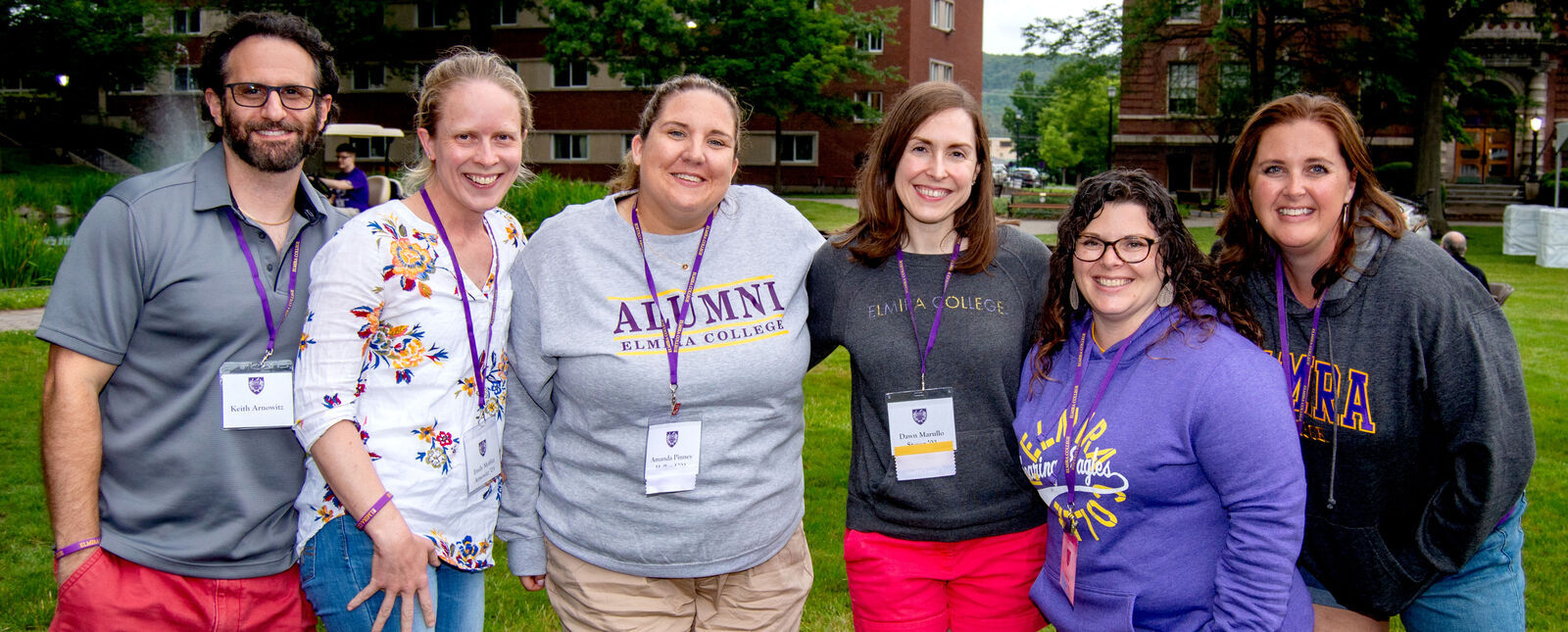 Six alumni stand together and smile during Reunion 2023