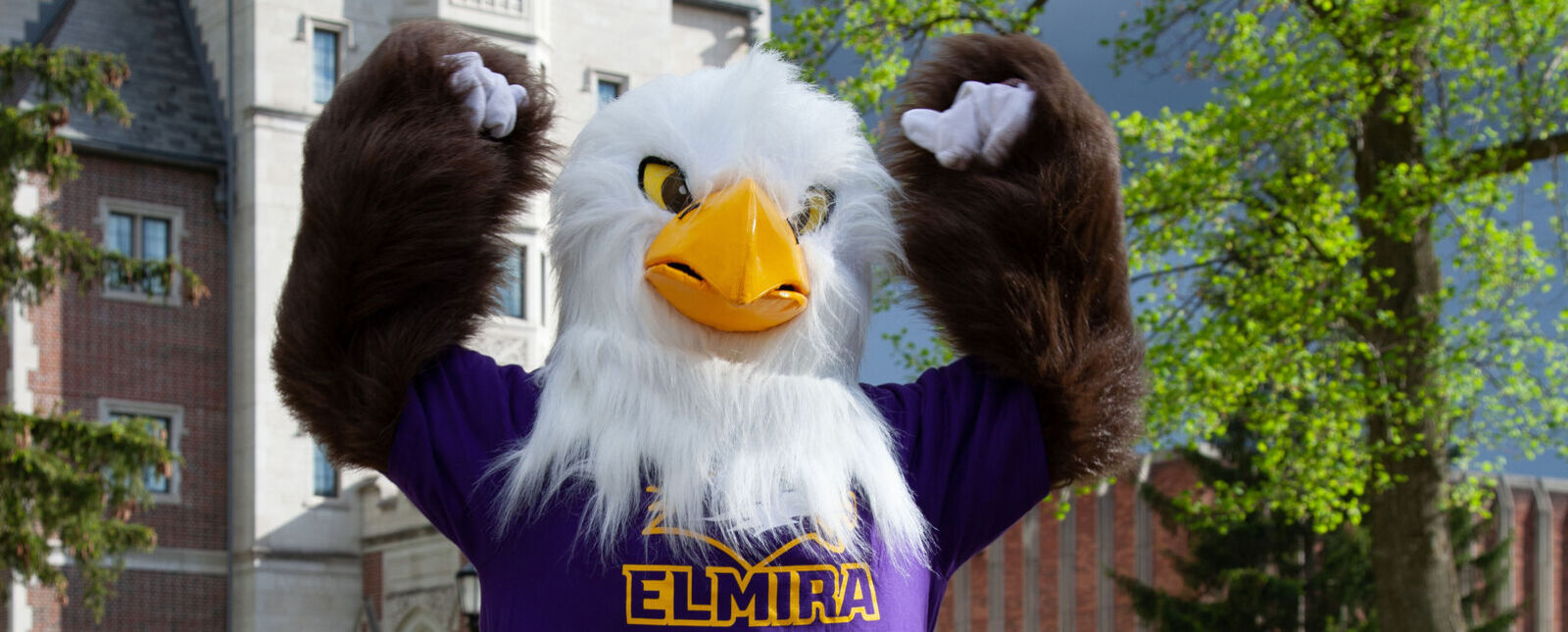 Simeon the Soaring Eagle flexes his muscles in front of Meier Hall