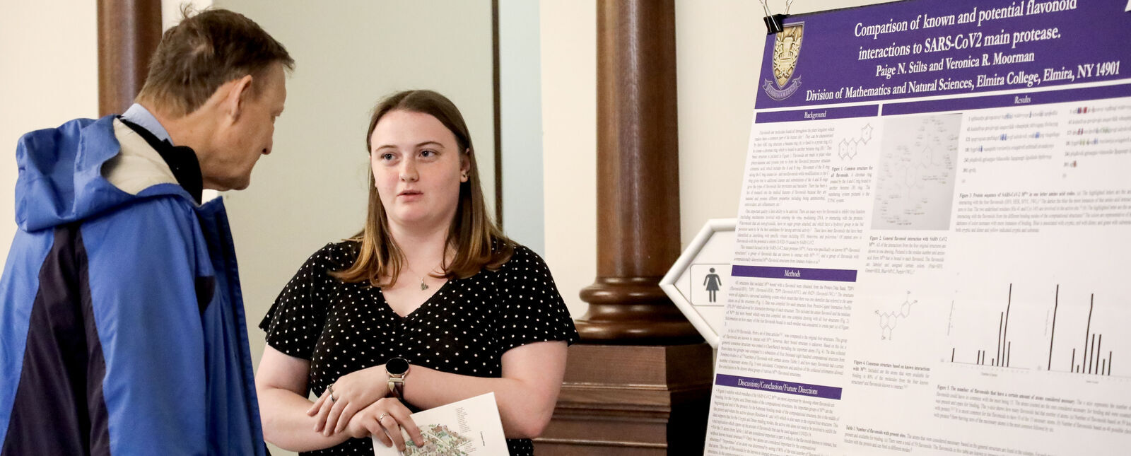 A female student presents research during the EC Student Research Conference