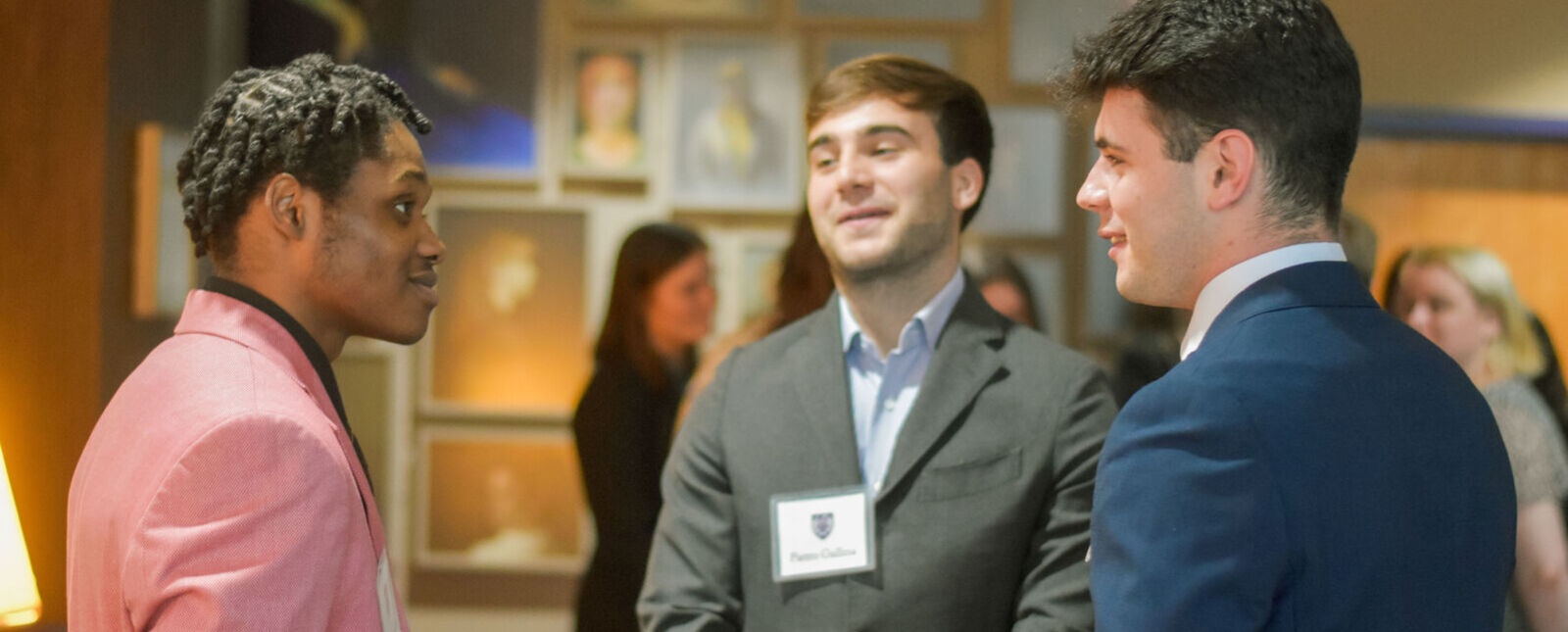 Students chat at an Under Wing networking event on campus. 